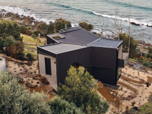 Wye House high angle over-looking the coast. The cladding and roofing is UniCote Coastal.